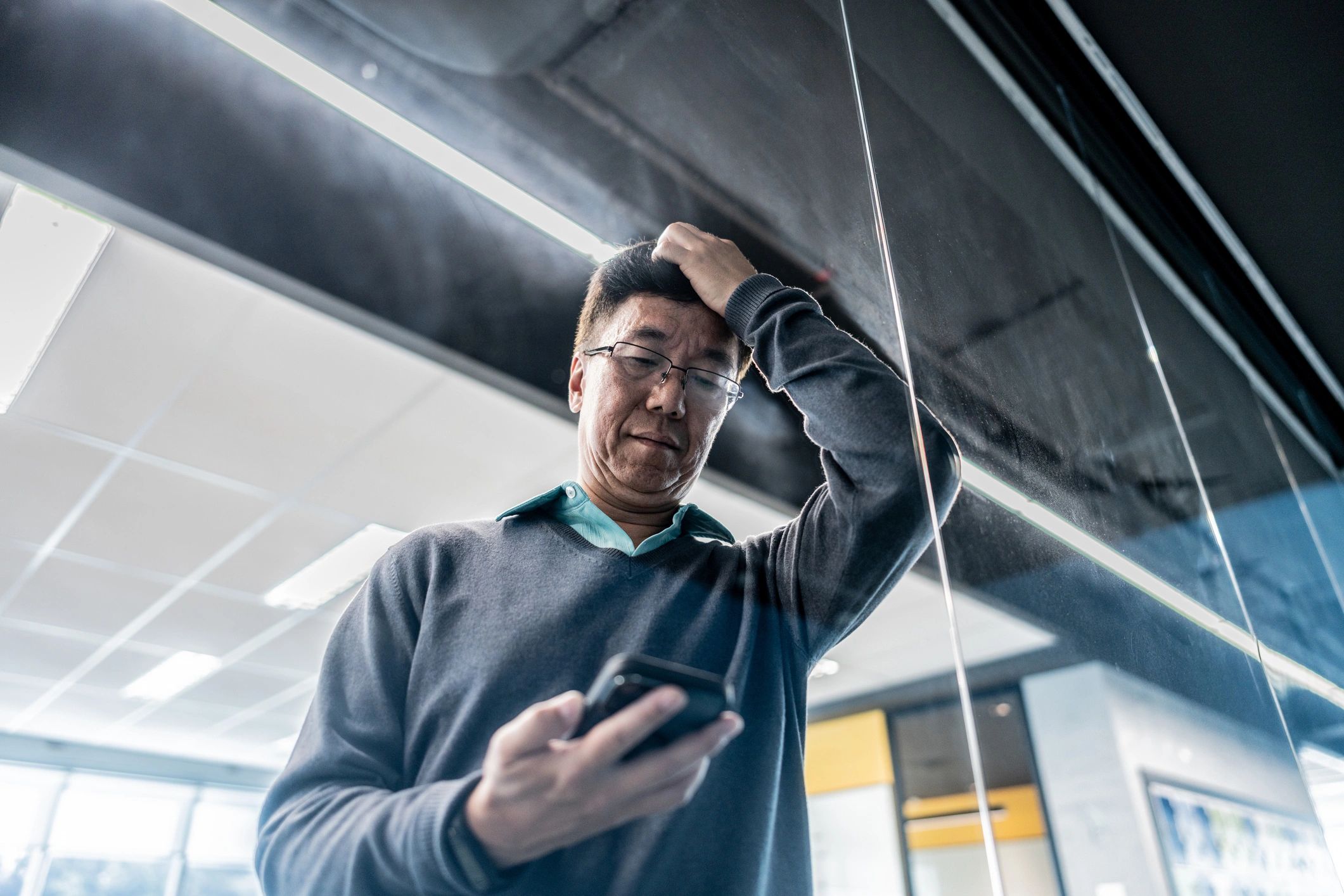 Business owner checking a missed call on a smartphone at the office